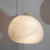 Hand‑Chiseled Galet Alabaster Brass Pendant Lamp – Sculptural Shine